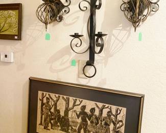 Assortment of wrought iron sconces and candle sticks