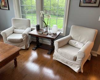 Slip covered armchairs with lumbar roll (30" W x 28" D) and trestle table (35.5" x 22" x 23") c. early 19th century - total of 4 available
