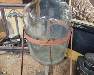 Vintage water glass jug with metal stand