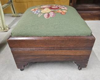 Antique foot stool with hand crafted needlepoint top