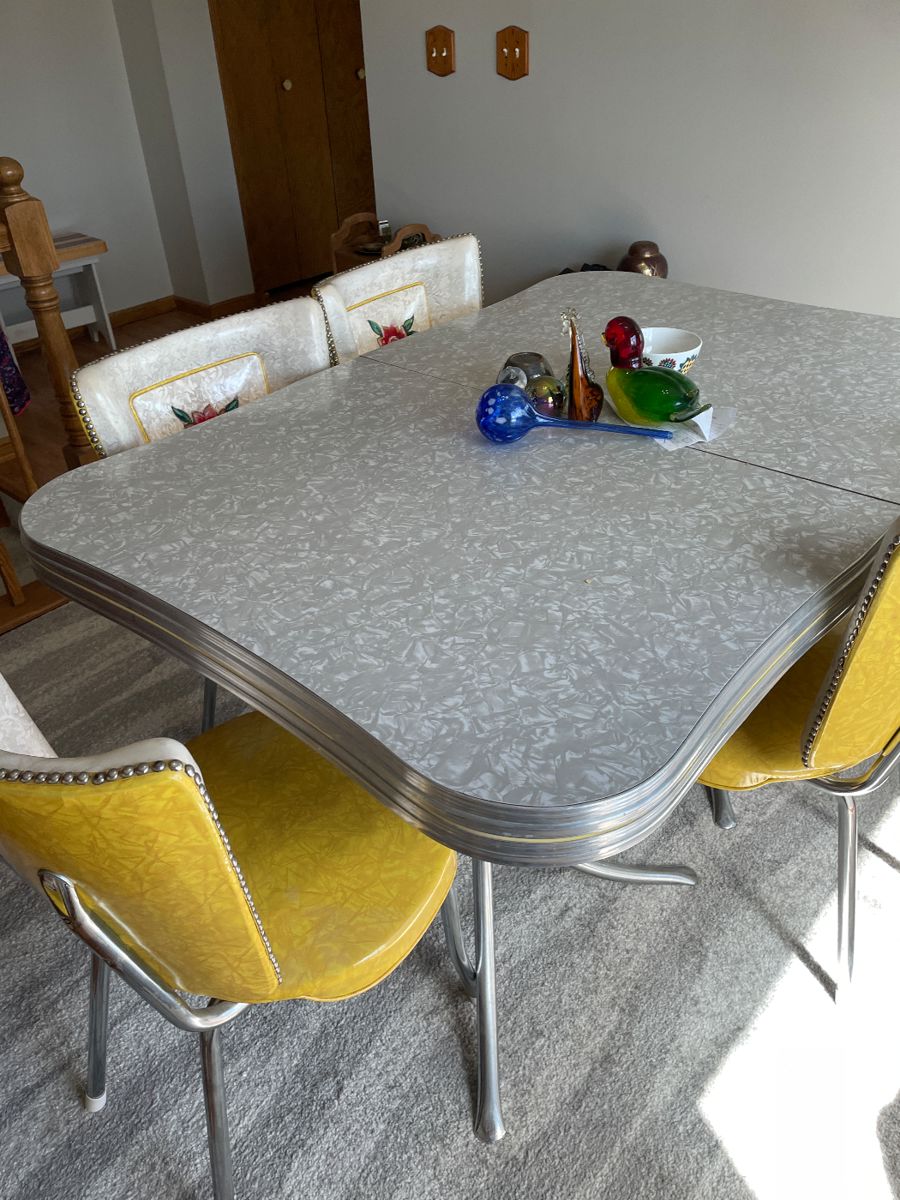 Great table with two leaves in wonderful condition. Six chairs with nail head trim.