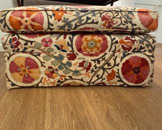 Brunschwig & Fils Dzhambul Upholstered Ottoman in Raspberry Orange Color Way (Cotton & Linen). Measures 34" W x 24" x 18" H. Photo 1 of 3.