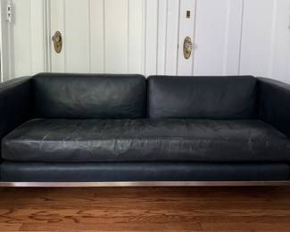 Pair of Le Corbusier LC2 Two Seat Sofa in Black Leather with Chrome Tube Steel Frames. Each Measures 62" W x 28" D x 27" H with 18" Seat Height. Photo 1 of 4.