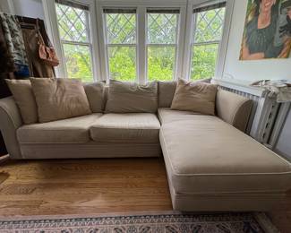 Cotton Upholstered Right Facing Chaise Sofa. Does Need Cleaning or Reupholstering. Measures 109" W. Chaise Measures 6' Deep. Photo 1 of 3.