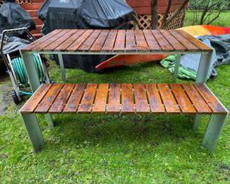 Stua Deneb Steel & Teak Dining Table & Bench Set. Table Measures 36" W x 63" L. Bench Measures 16" D x 55" L.