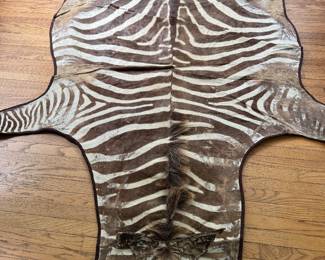 Zebra Hide Rug. Measures Approximately 8' x 6'. Photo 1 of 4.
