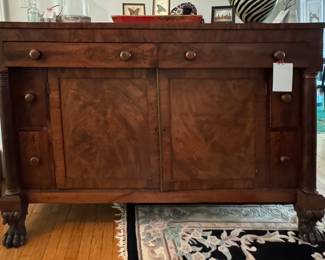 Antique Flame Mahogany Buffet. Measures 66" W x 24" D x 44" H.