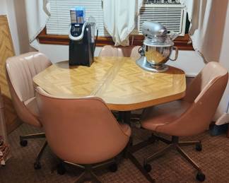 1980's Golden Girls style kitchen table with leaf and four rolling chairs (very comfortable!)