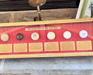 The evolution of the golf ball in showcase art hanging