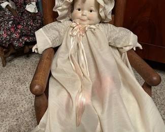 This doll has three face positions, smiling