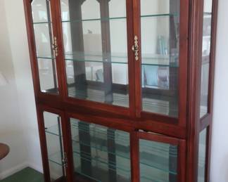 20 Glass front curio cabinet It is 52" wide x 11" deep. The hgt is 76" Price is 295.00.