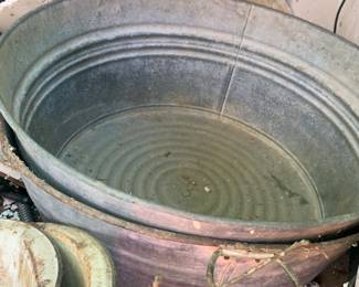 A collection of metal washtubs