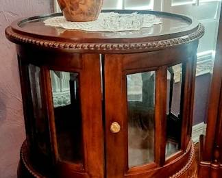 Plourd round curio display caibinet