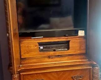 Plourd wardrobe open to tv stereo