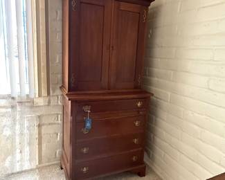 Secretary early 19th century Chippendale cherry butlers chest.