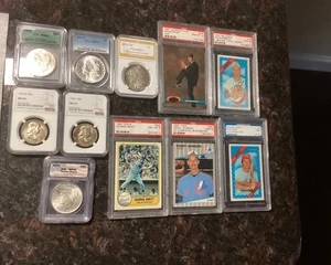 Assorted graded cards and coins.