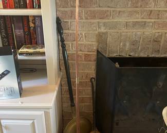 Antique brass bed warmers.