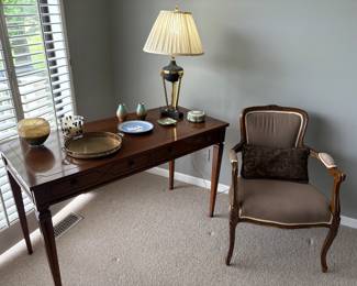 Wood desk w drawers or console table, arm chair, lamp, and brass, Wedgwood, and pottery pieces