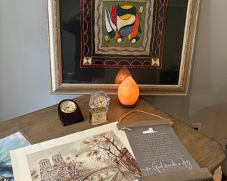 Herman Miller clocks, Himalayan pink salt lamp, framed artwork, and prints