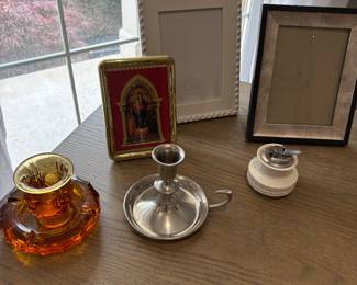 Vintage cigarette holder and ashtray, pewter candle holder, and frames