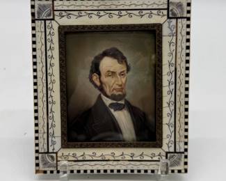 Painted miniature on bone/celluloid of Abraham Lincoln in bone carved frame