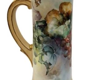 T&V LIMOGES FRANCE HAND PAINTED TANKARD.
14.5" TALL HAS FACTORY FLAW ON THE RIM UNDER THE GLAZE