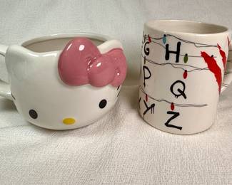 Hello Kitty and Stranger Things mugs