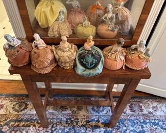 Wonderful collection of antique vintage porcelain doll pin cushions.