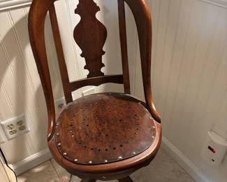 Wooden swivel office chair.