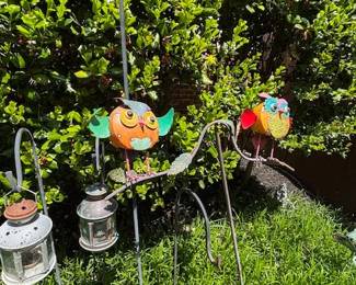 Shepherd's Hooks with hanging lanterns.