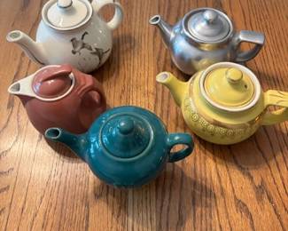 Assorted Hall's small teapots.