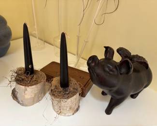 Carved pig and candlestick holders.