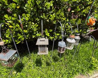 Shepherd's Hooks with hanging lanterns.