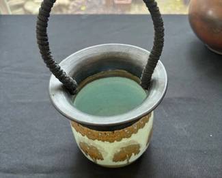 Handmade bowl with handle.