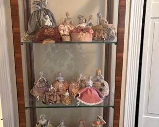 Wonderful collection of antique vintage porcelain doll pin cushions.
