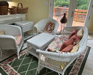 Set of white wicker furniture.