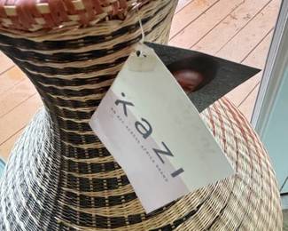 Kazi hand-woven vase on stand.