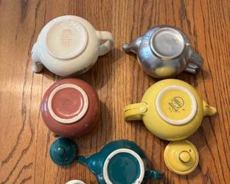 Assorted Hall's small teapots.