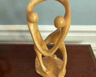 Hand-carved family sculpture.