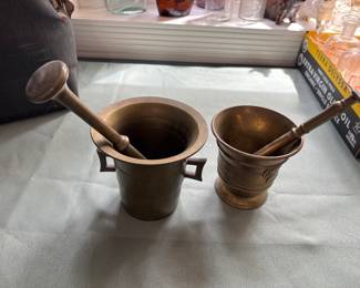 Vintage brass mortar and pestles.