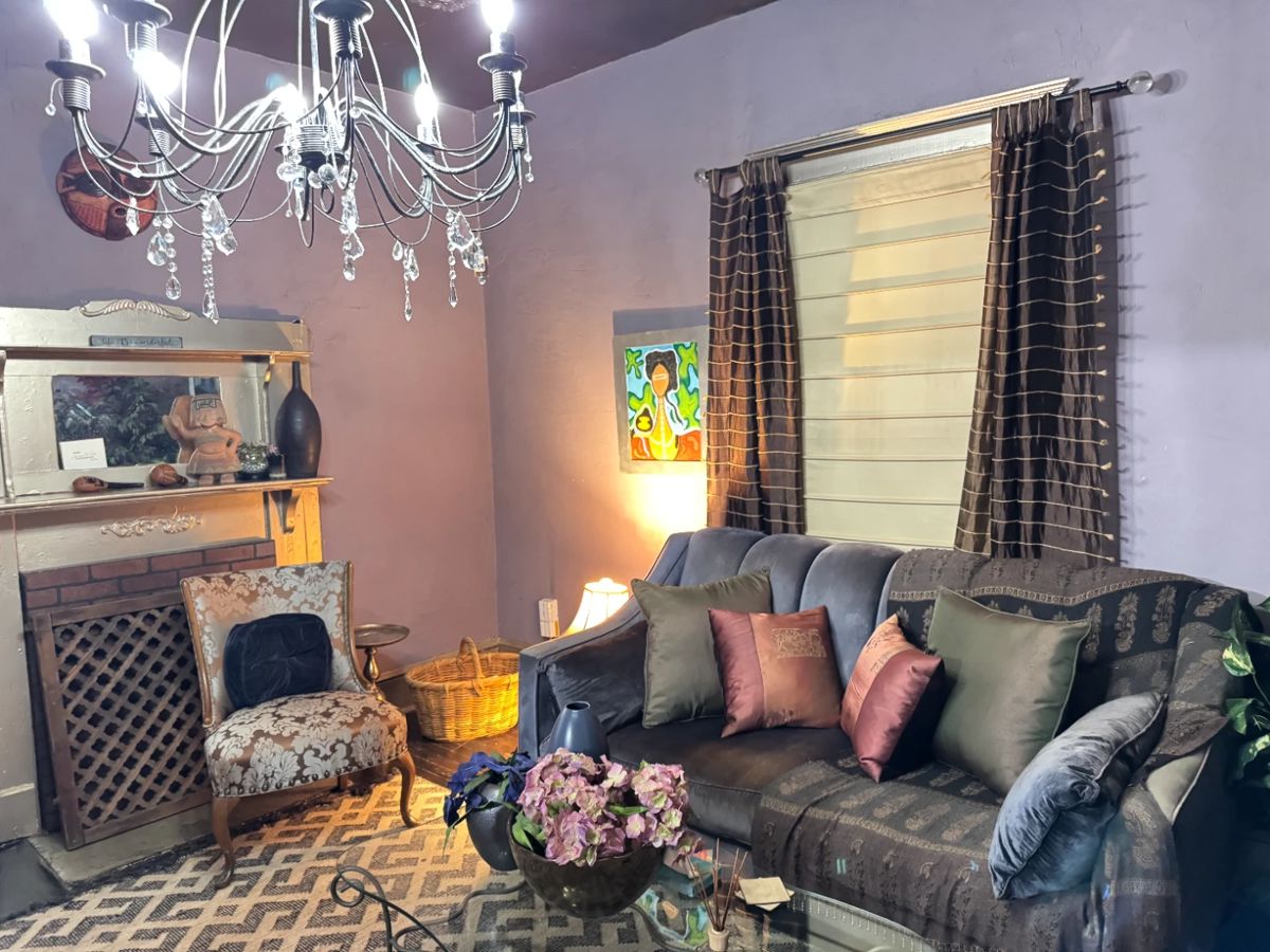 All items are for sale including the sofa, rug, 2 matching antique chairs (professionally reupholstered), metal and glass coffee table, chandelier, curtains, bowls and vases and pillows