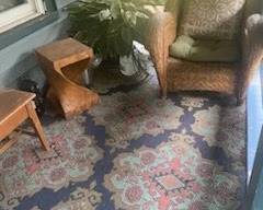 This chair is a favorite from Pottery Barn! Its a great find...and no, the plant next to it isn't real. Its fake and its for sale too! Cool wooden benches and stools are available too. There are 2 of these outdoor rugs available to purchase
