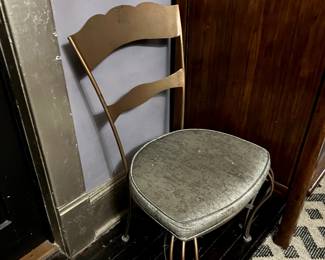 Single metal side chair in copper with silver/black attached seat cushion