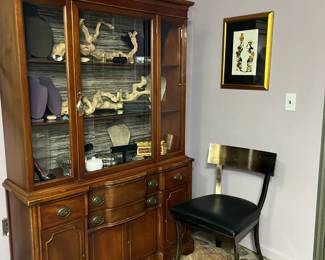 This China Cabinet was last used to store jewelry, handbags, and scarves...proof that there is more than one way to use a cabinet. The single metal chair with leather seat is a comfortable statement piece. Treat yourself to a new jewelry box or buy it for your mother :)