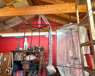 There are 2 of these brand new Wrought iron chandeliers. One is hung on display in the front bedroom. Both are new and from Ballard Designs.
