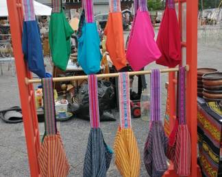 Only a couple of these colorful, reversible, cross-body bags with hand woven Ecuadorian straps remain. Get yours while they last. The easily fit your belongings or laptop and can be worn as part of your outfit and filled as you shop. They are light-weight, washable, and packable