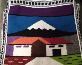 There is also an assortment of large and small handwoven, zippered, wool cross body bags