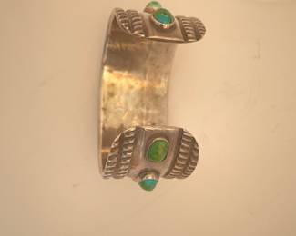 $450.  Very heavy Navajo silver and turquoise cuff