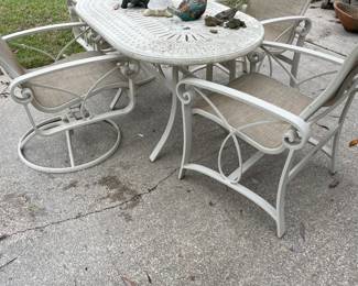Patio table with 2 arm chairs and two rockers