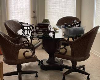 $400 Decorative, rattan dinning table.   Comes with casters for chairs, but the casters are not currently shown